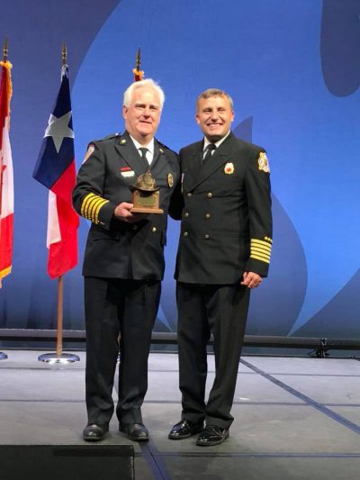 The CT Fire Chiefs Assoc. Congratulates Chief TIm Wall of the North Farms (Wallingford) FD on receiving an IAFC President's Award presented at the Opening Session of FRI 2018. Later in the day, the IAFC VCOS section presented Chief Wall with a gift and elected him to Chairman Emeritus. Thanks Chief Wall for your Leadership and many years as VCOS Chair.
